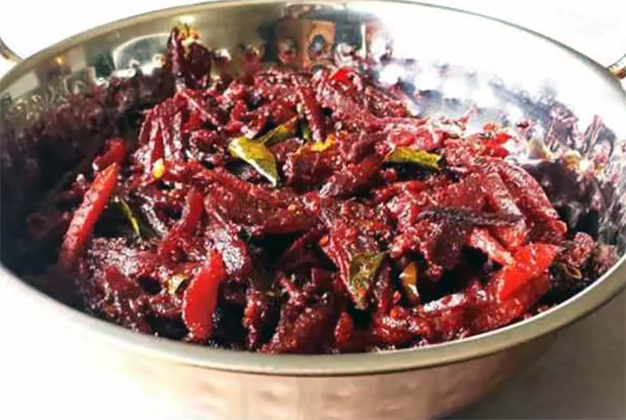 grated beet pickle in a metal dish