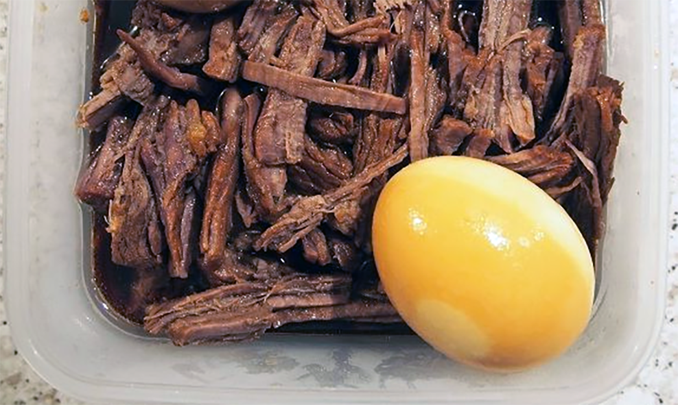 Jangjorim beef strips served on a plate with a hard-boiled egg