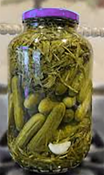 khiar shoor, Persian pickled gherkins in a large glass jar