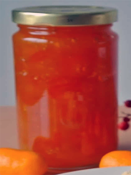 kumquat preserve in a glass jam jar