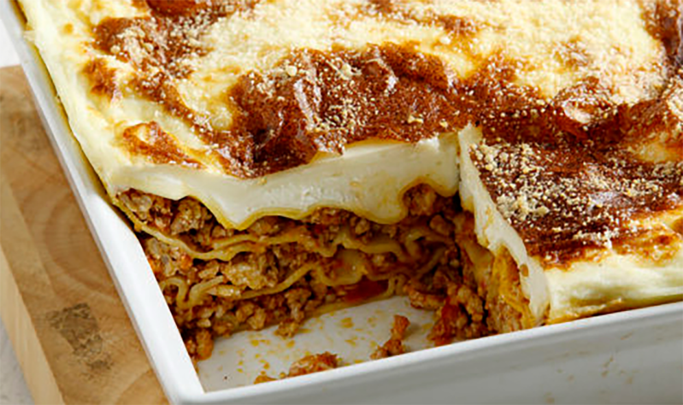 Cypriot lasagne with a square removed to reveal the filling