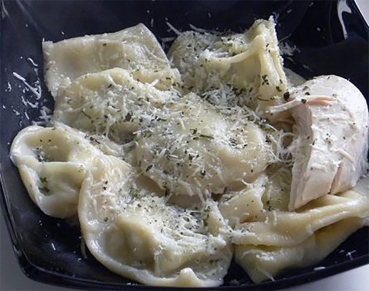 cypriot cheese ravioli in a black bowl