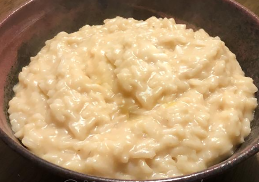 Chadian rice porridge accompaniment served in a wooden bowl
