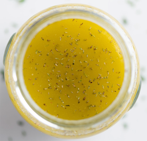 Greek ladolemono dressing in a glass jar