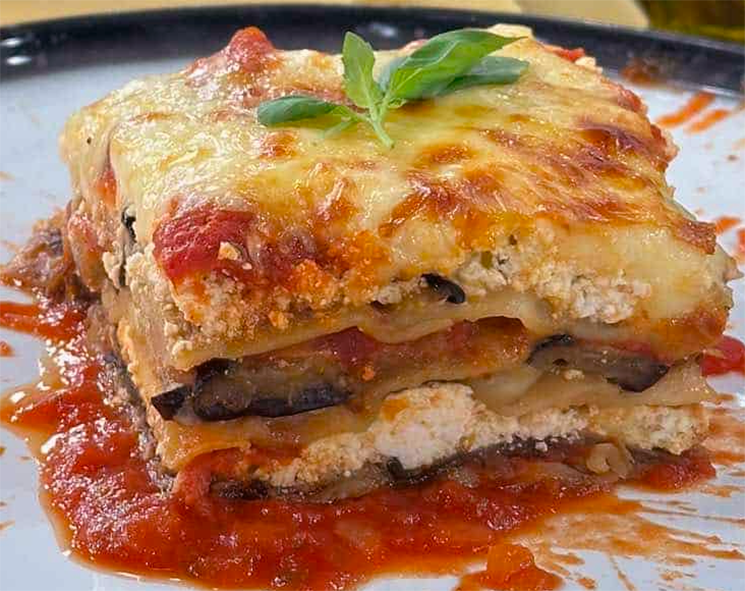 square of baked cyrpiot lasagne on a white plate