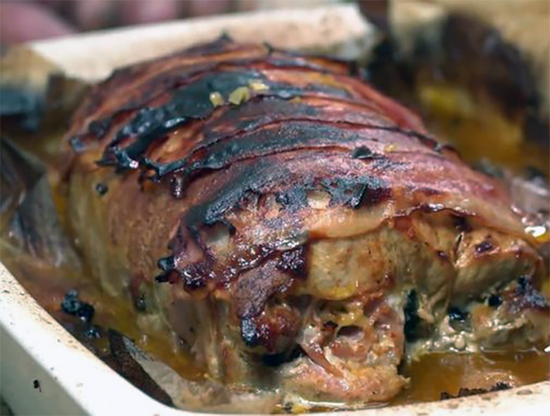 Rolled boar loin baked with plums, fumet and port wine