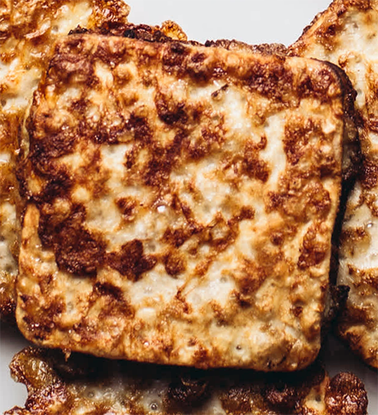 m'chaqub, stuffed matzoh breads piled on a plate