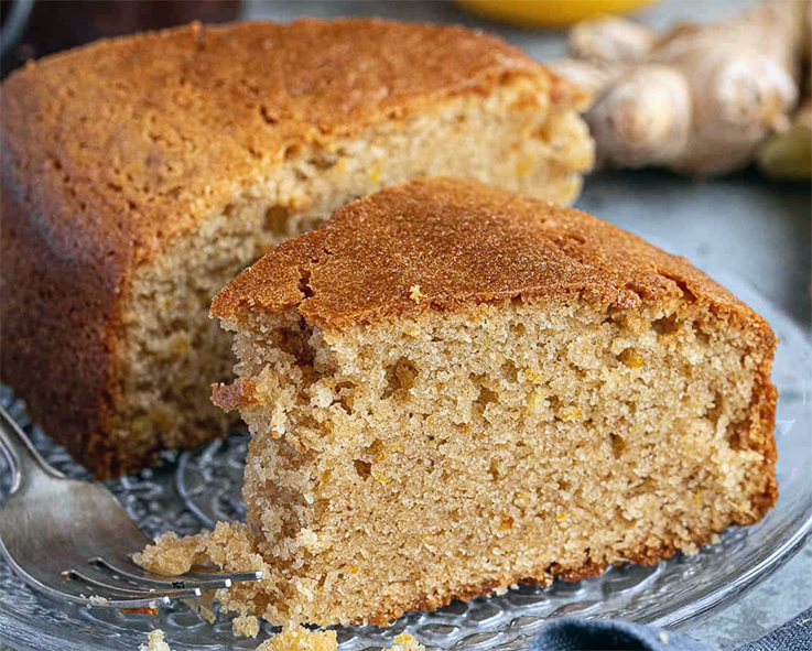 two slices of marmalade and ginger cake on a glass plate