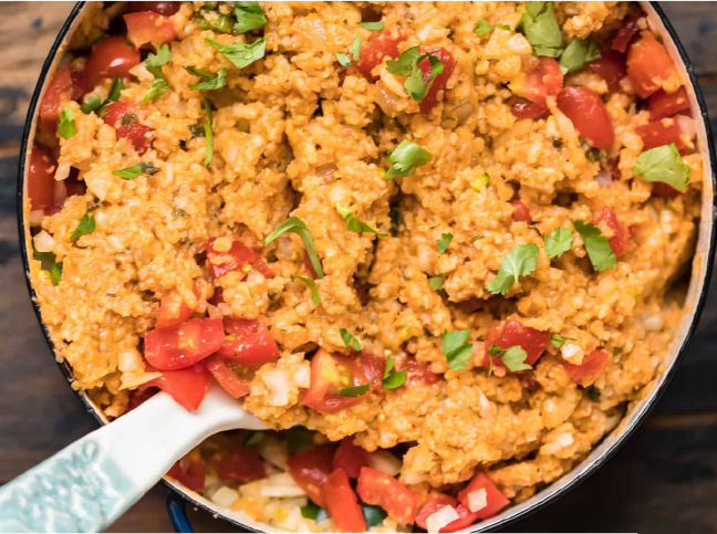 Mexican rice served in a bowl with a spoon