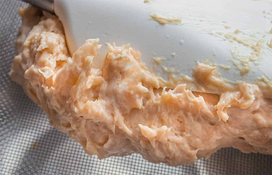 Fish forcemeat on a spatula