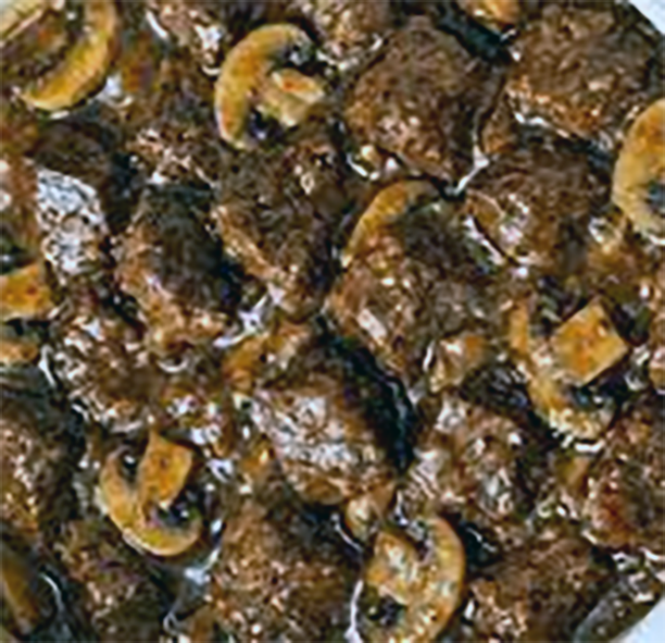mutton and mushroom stew with stout in a casserole dish
