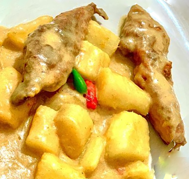 cassava and dried fish in a coconut base