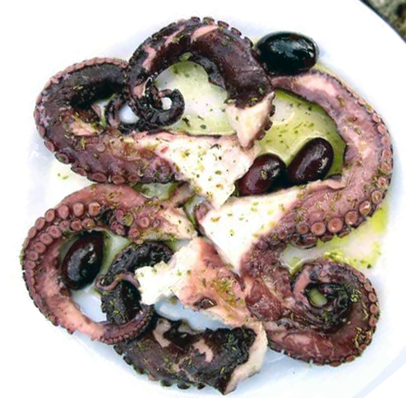 pickled octopus tentacles served with olives and olive oil on a white plate