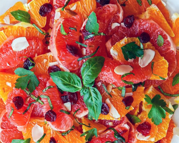 salad of segmented orange and blood orange with raisins, almonds, basil and flat-leaf parsley</a>