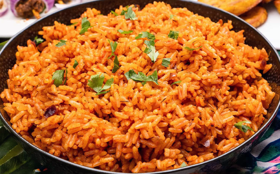 oven-baked jollof rice garnished with coriander leaves in a baking dish