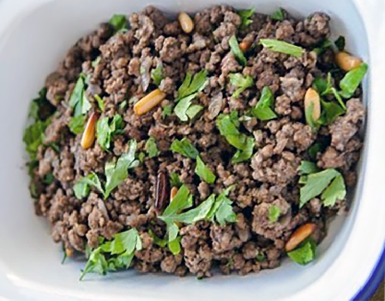 meat stuffing in an enamelled baking dish