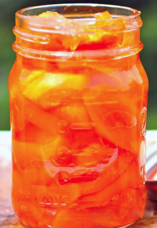 pickled papaya in sugar syrup packed in a jar