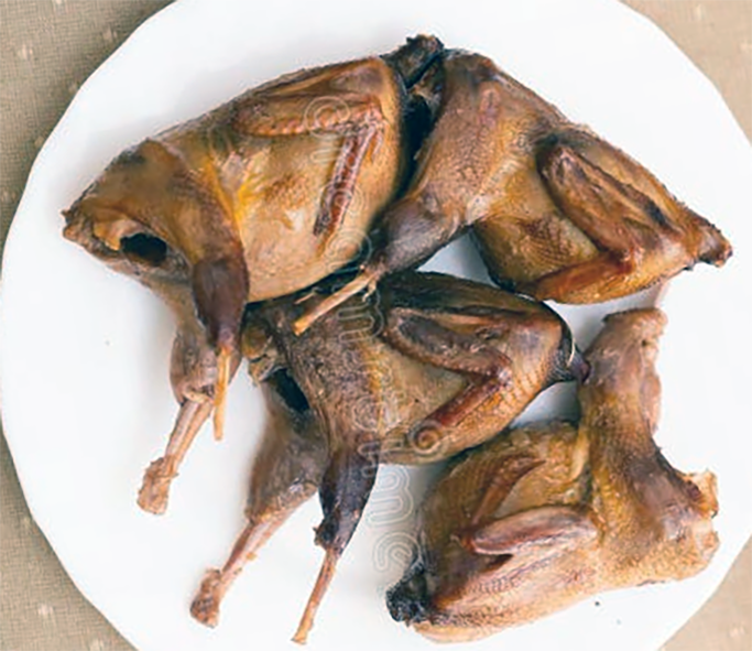 oven-roasted partridges served on a white plate