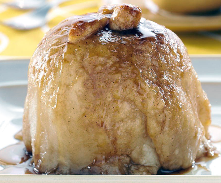 apple dumpling with syrup on a plate