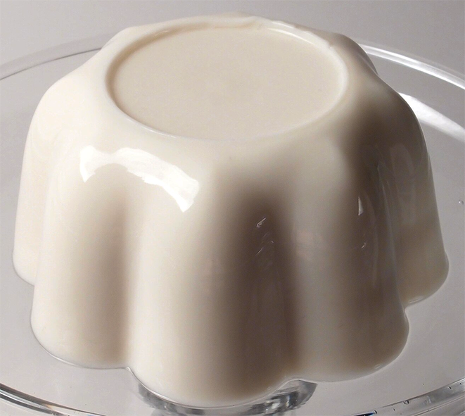 white blancmange on a glass plate