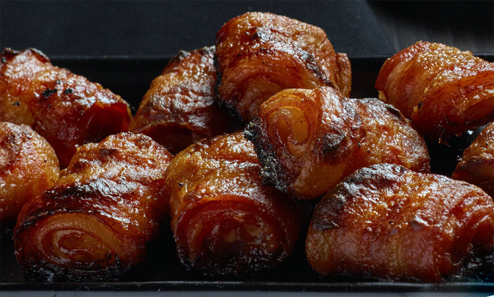 baked rolled bacon on a plate