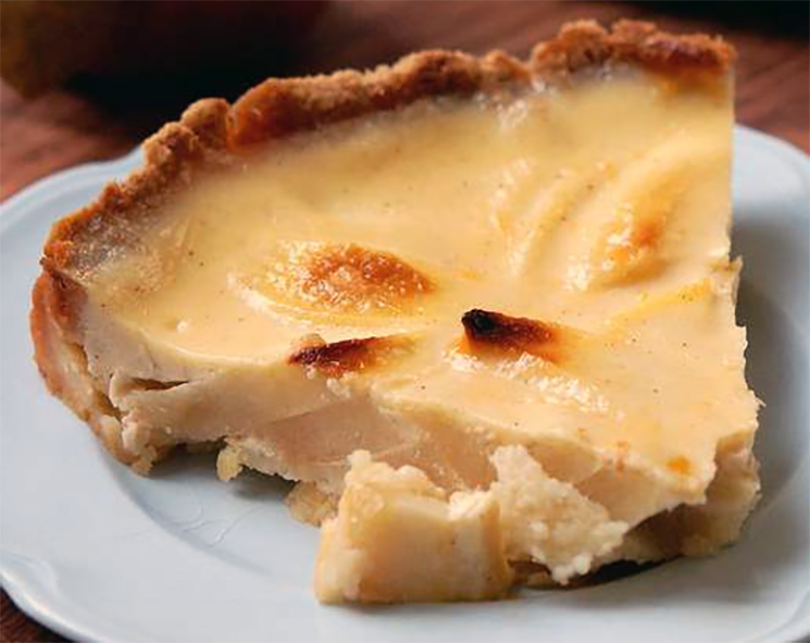 wedge of apple custard tart on a plate