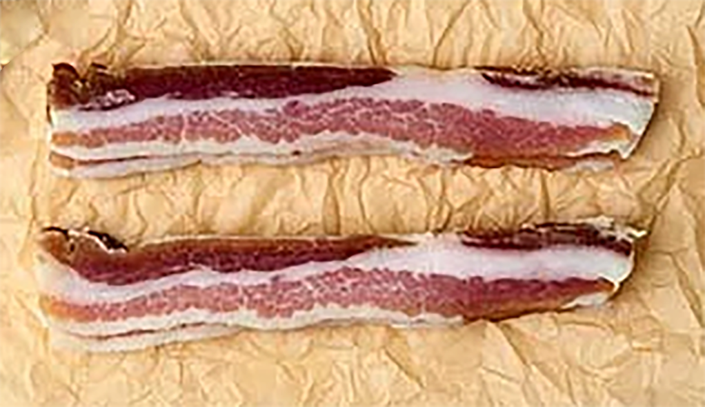two pieces of home-cured bacon