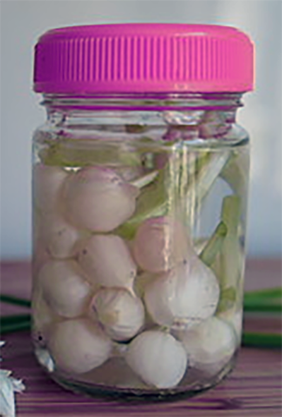 pickled three-cornered leek bulbs in a jar