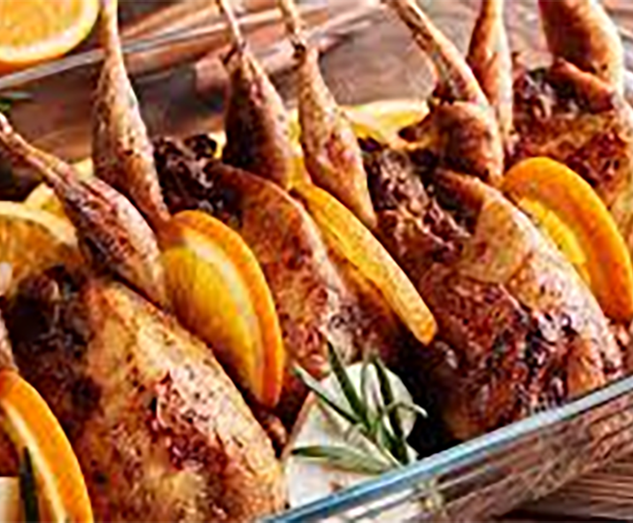 pigeons in a glass dish separated with slices of orange