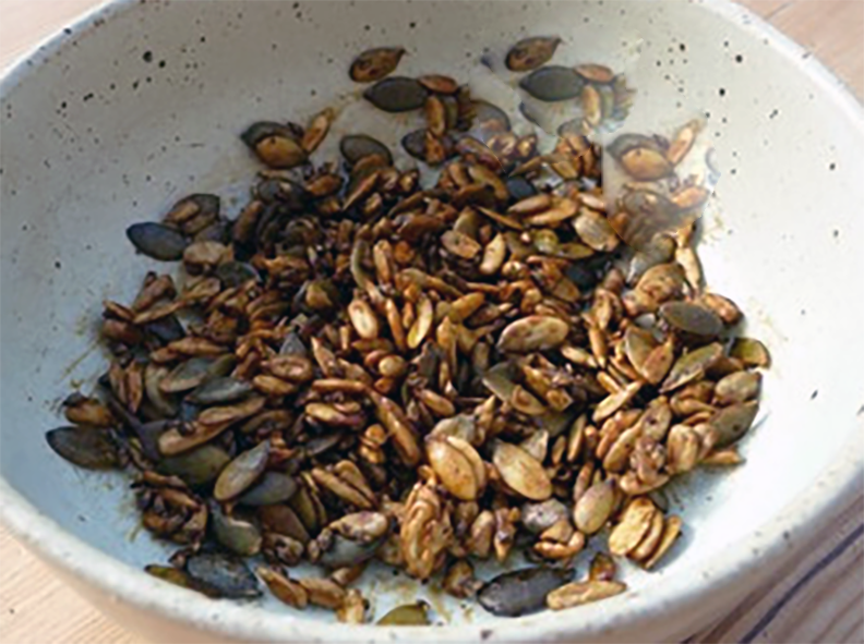 plantain seeds with pumpkin seeds and sesame seeds in a bowl