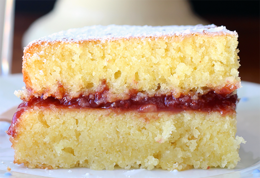 slice of tortal maria luisa from Colombia with a plum jam filling on a plate
