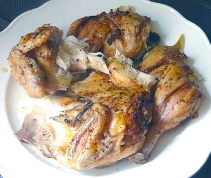 Ivorian-style roast chicken jointed and arranged on a plate