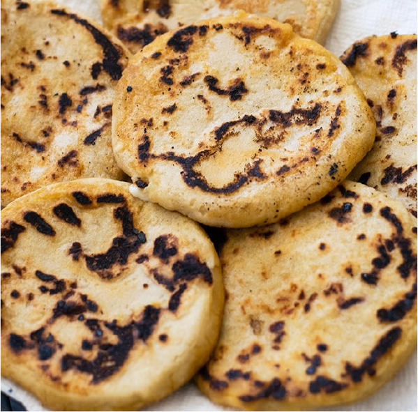 cheese-filled pupusas arranged on a plate