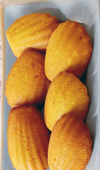 safflower madeleines arranged on a serving plate