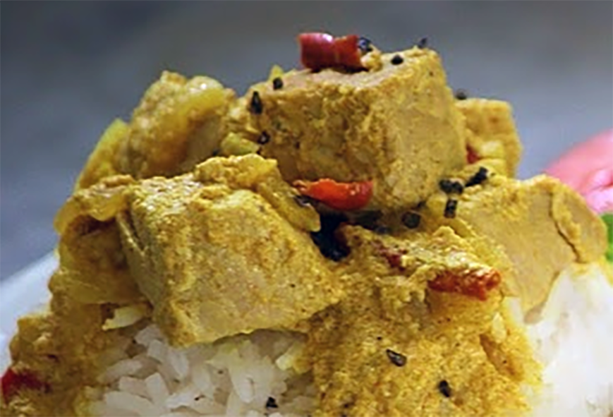 tuna braised in coconut milk served on a bed of rice