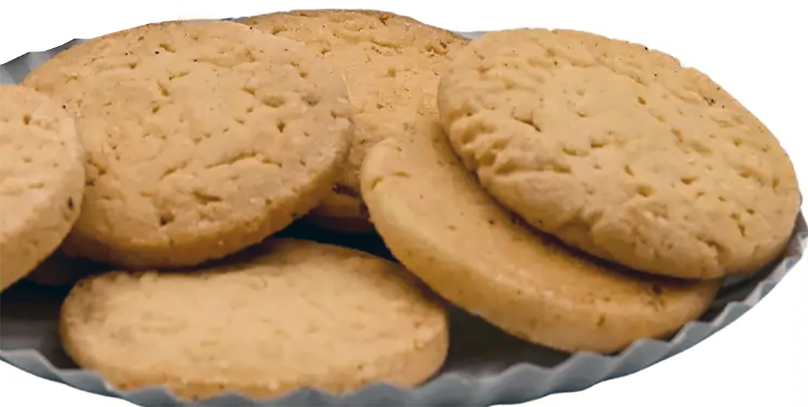 plain Shrewsbury biscuits arranged on a plate