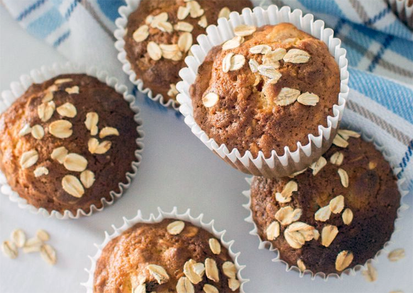 dried apricot and oat muffins garnished with rolled oats