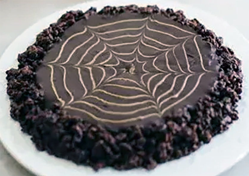 spider web munch, peanut butter bound rice krispies topped with chocolate and a spider web pattern