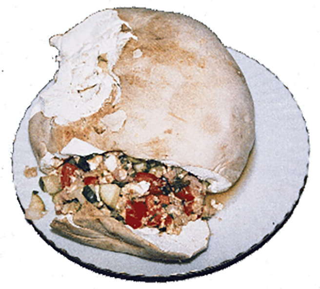 stuffed giant puffball mushroom presented on a plate