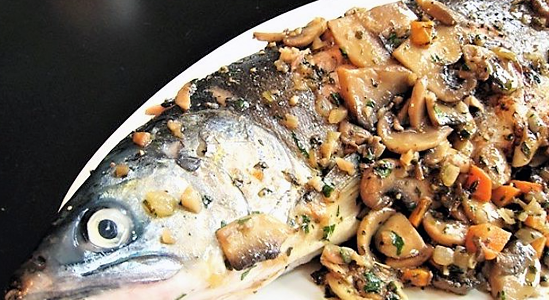 whole fried trout served with porcini mushrooms
