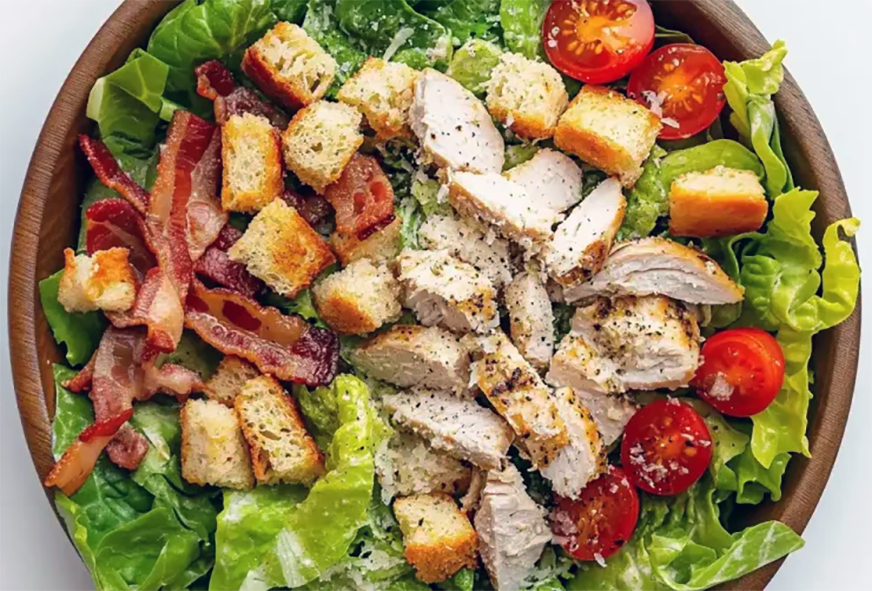 turkey and bacon Caesar salad in a bowl