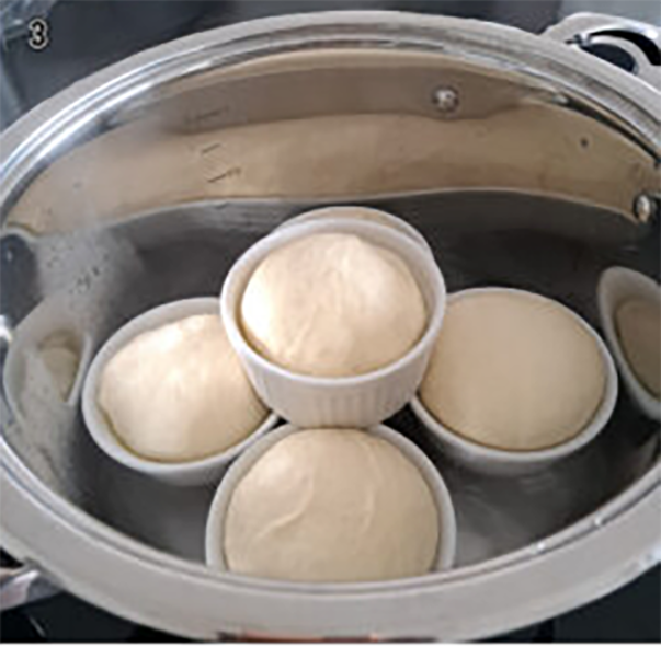 south african steamed bread buns in the pot of a pressure cooker