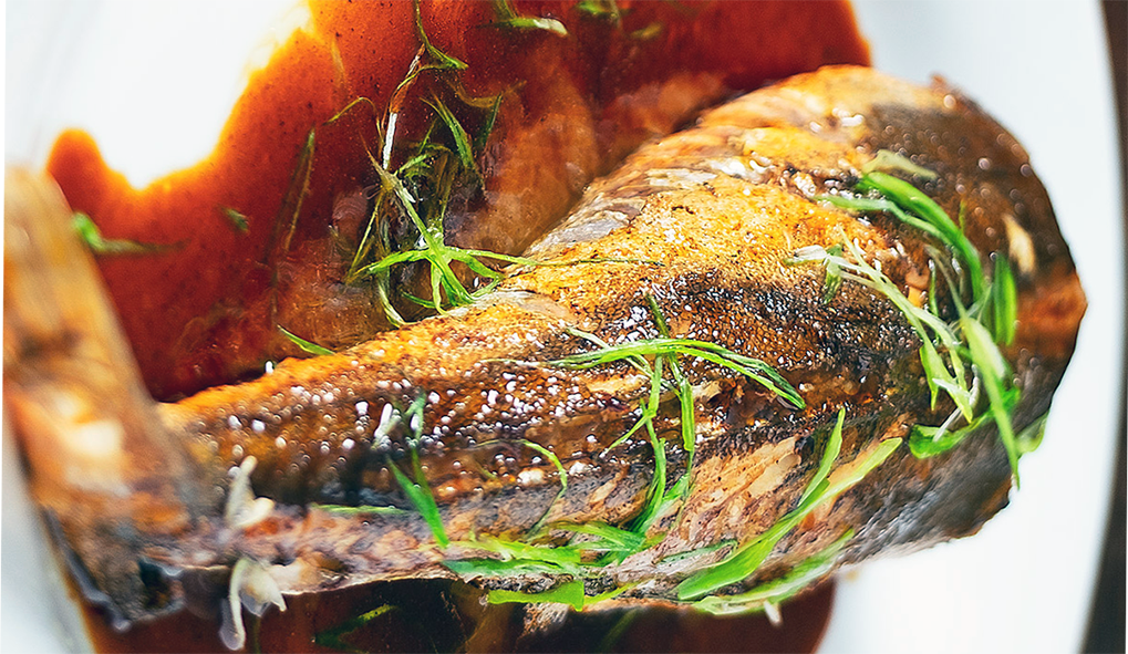 parcel-baked gurnard served on a tamarind sauce base