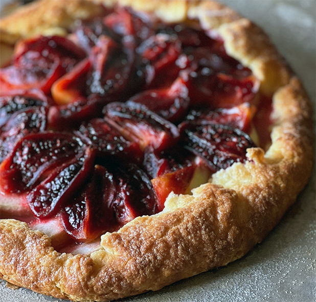 tamarillo topped vanilla apple and tamarillo galette on a work surface