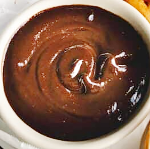 pickled walnut shell ketchup in a small bowl
