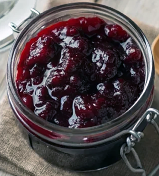 jar of cherry and currant marmalade viewed from above