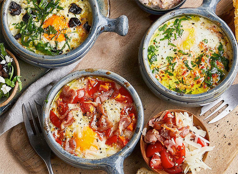 air fryer baked eggs in cocottes with three different toppings