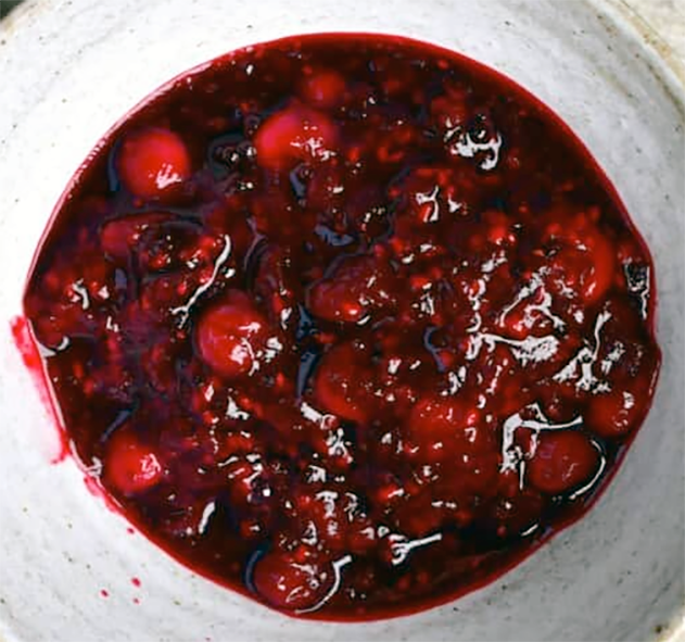 mixed berry compote cooked in Ribena served in a bowl