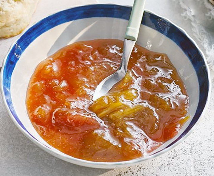rhubarb and ginger conserve in a bowl with a blue rim
