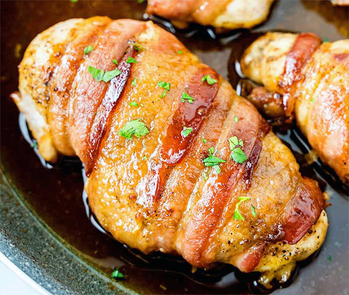 bacon wrapped lavender chicken in a roasting tin